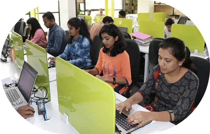 Brainmine developers working on laptops at their workstations
